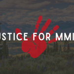 Justice for MMIW written over a red handprint on a Wyoming landscape